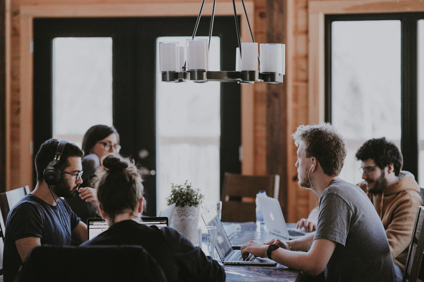 A team collaborating around a shared workspace